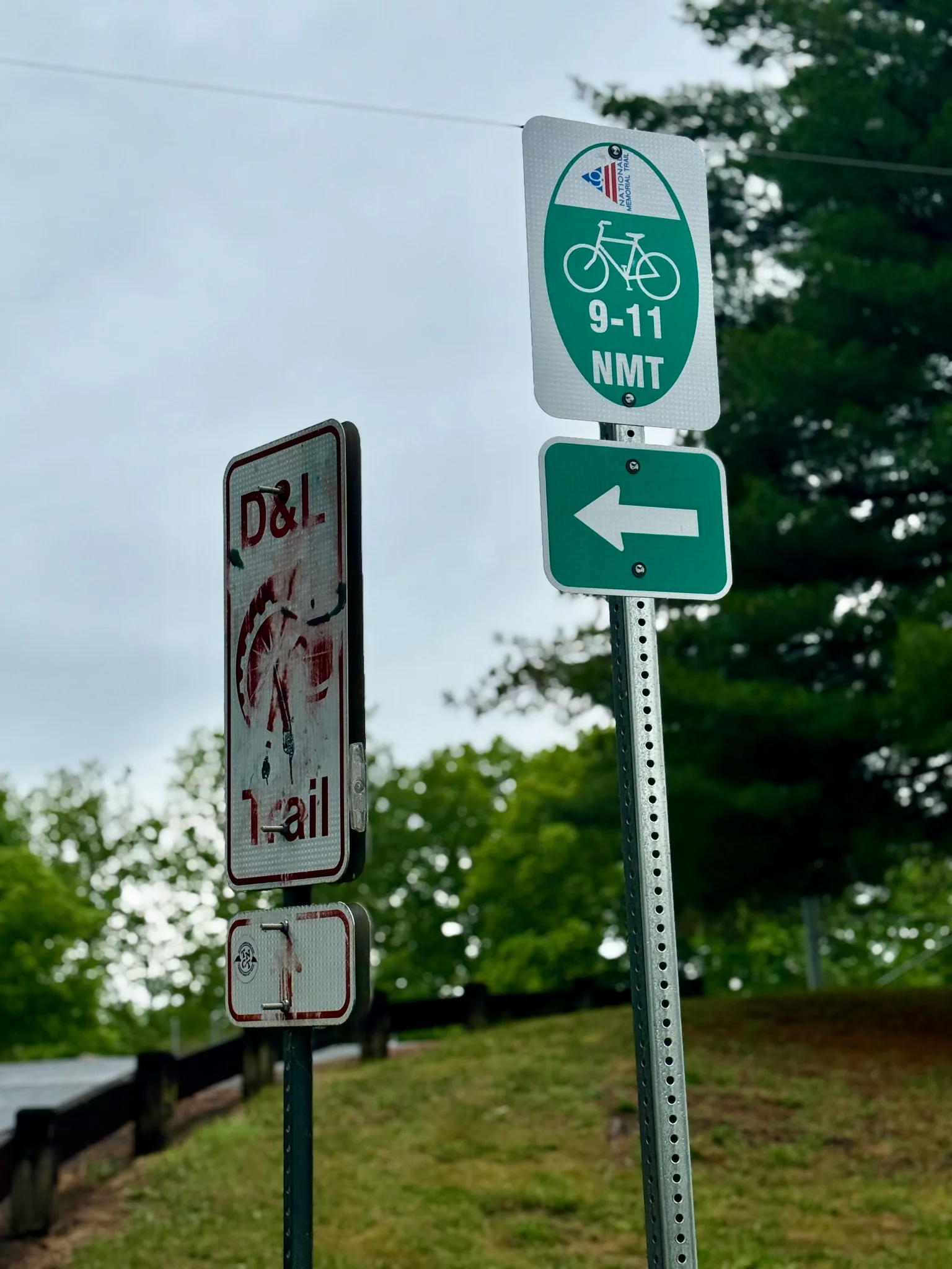 9/11 Trail signage alongside a D&L sign in Allentown